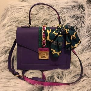 Aldo purple bag with gold chain and green scarf